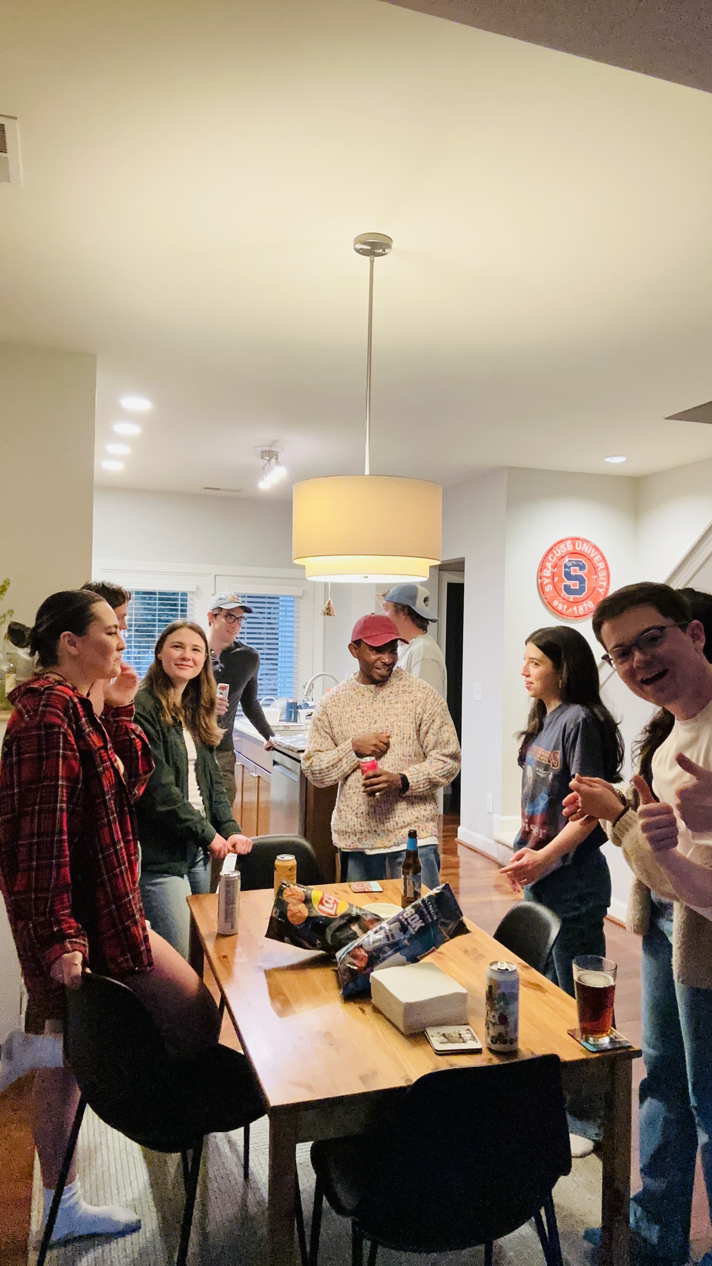 Friends gathered around the table, mid conversation