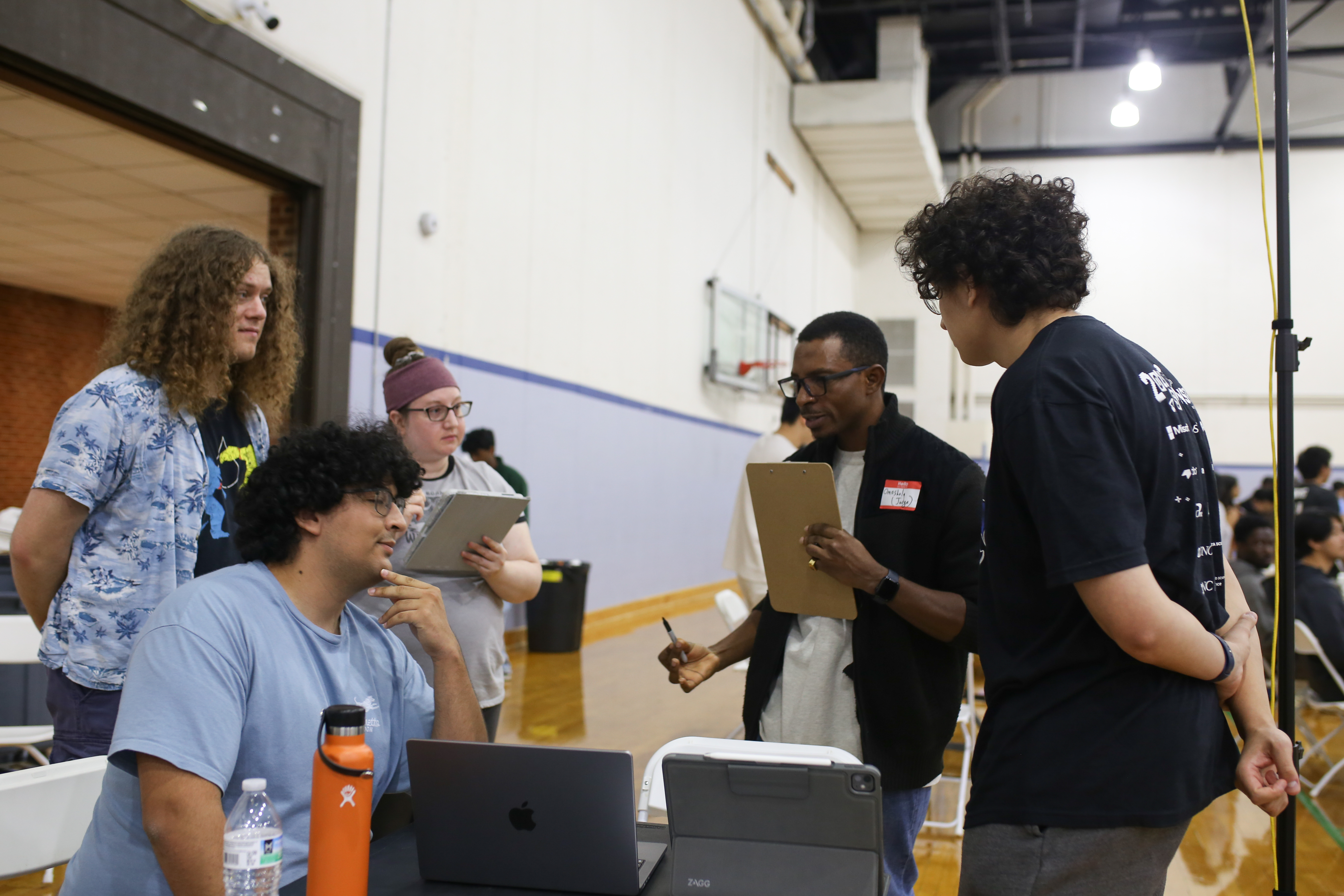 Judges on the HackNC floor, mid-rotation