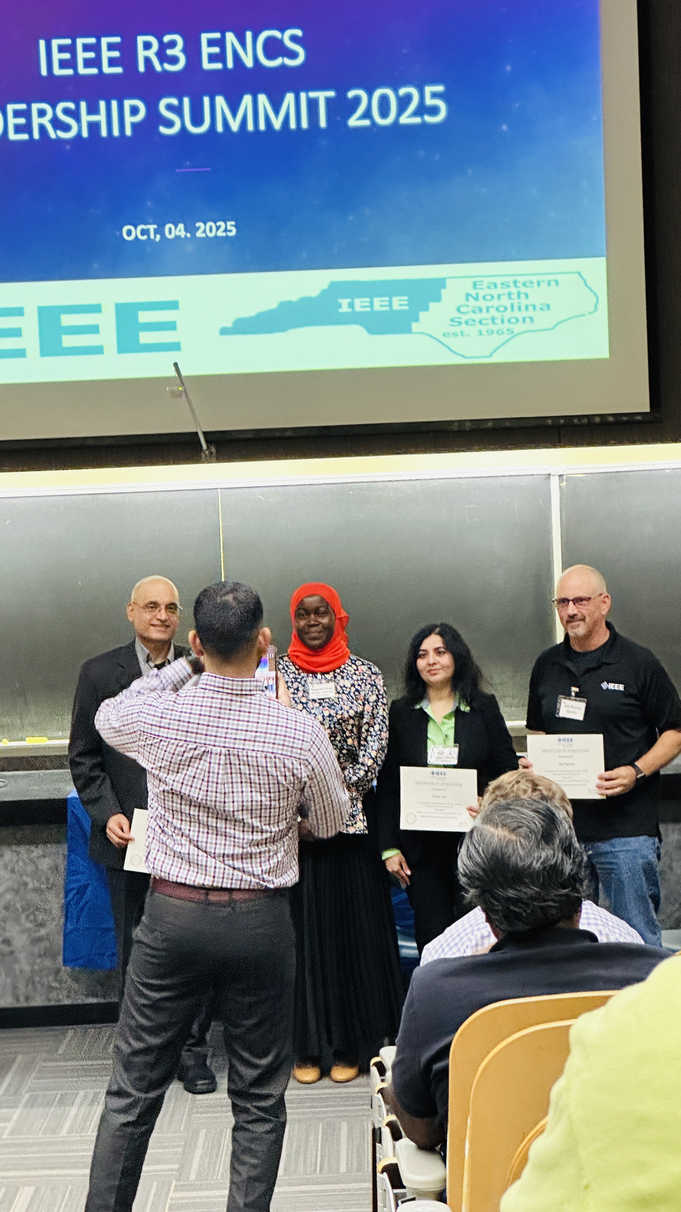 Certificate recipients being recognized at the summit