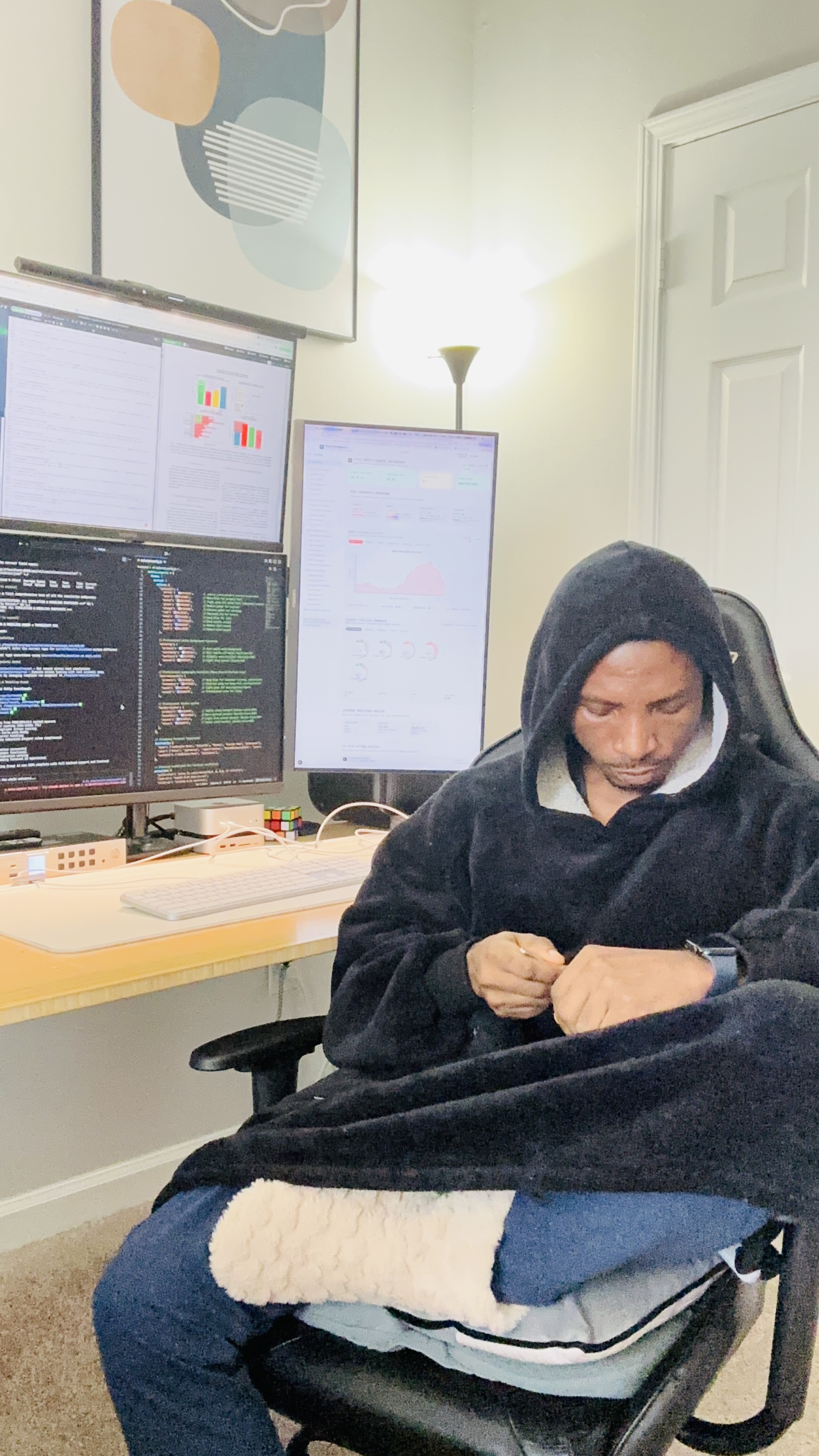 Omoshola Owolabi at his desk