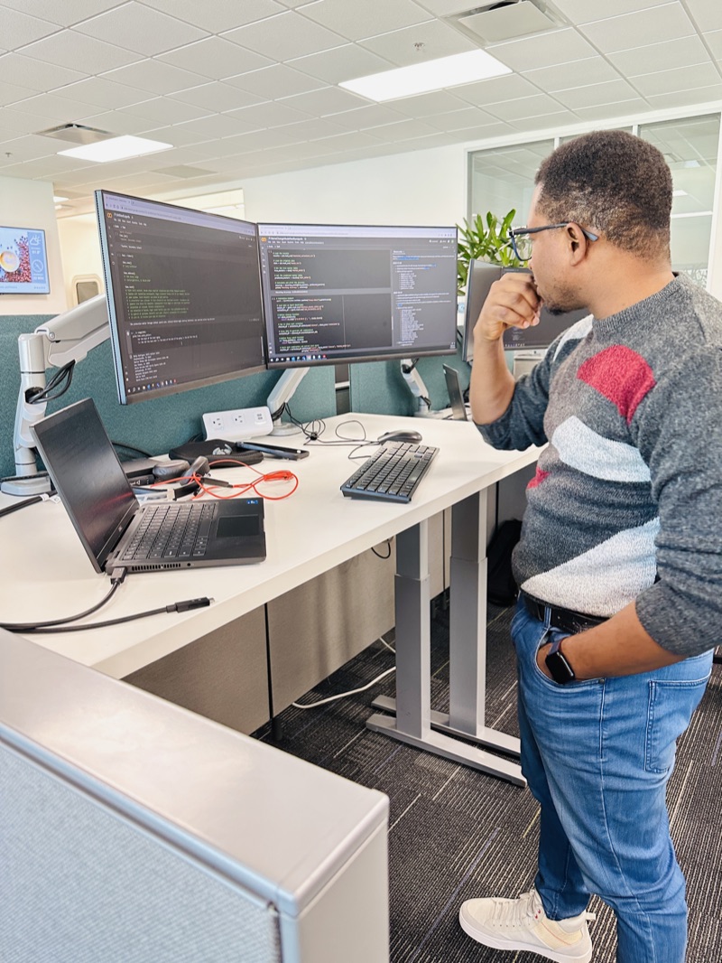 Omoshola Owolabi at his desk