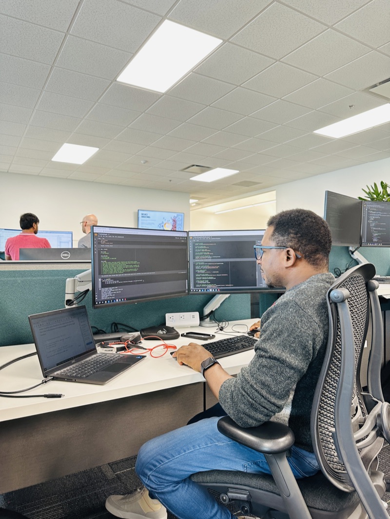 Omoshola Owolabi working at his desk